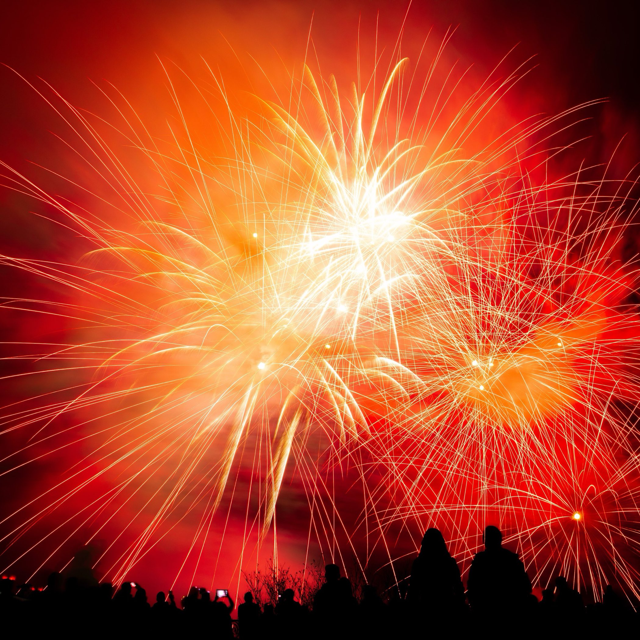 Fireworks bursting over Niagara Falls at night
